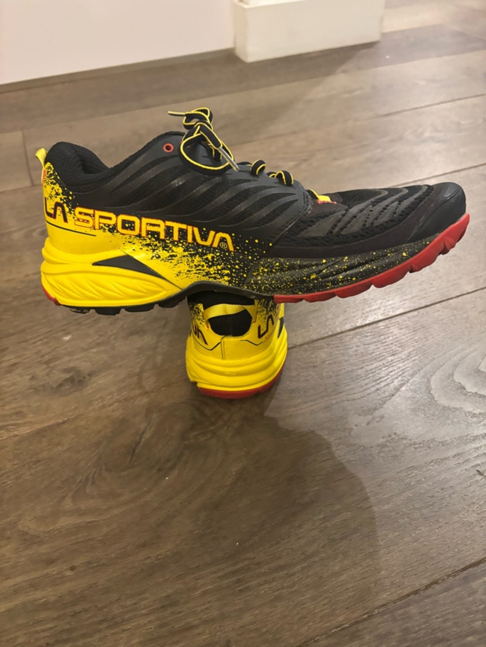 La Sportiva men’s Yellow and Black Sneakers size 10.